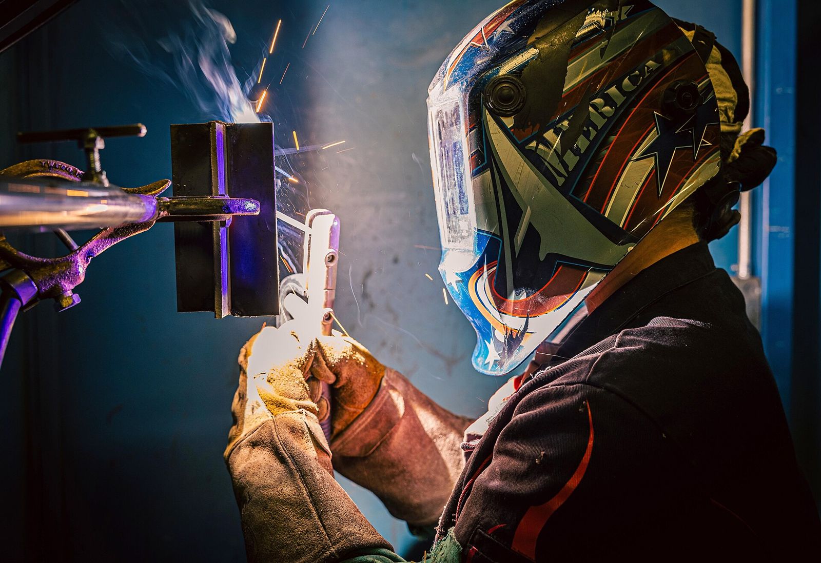 Welder at work with sparks